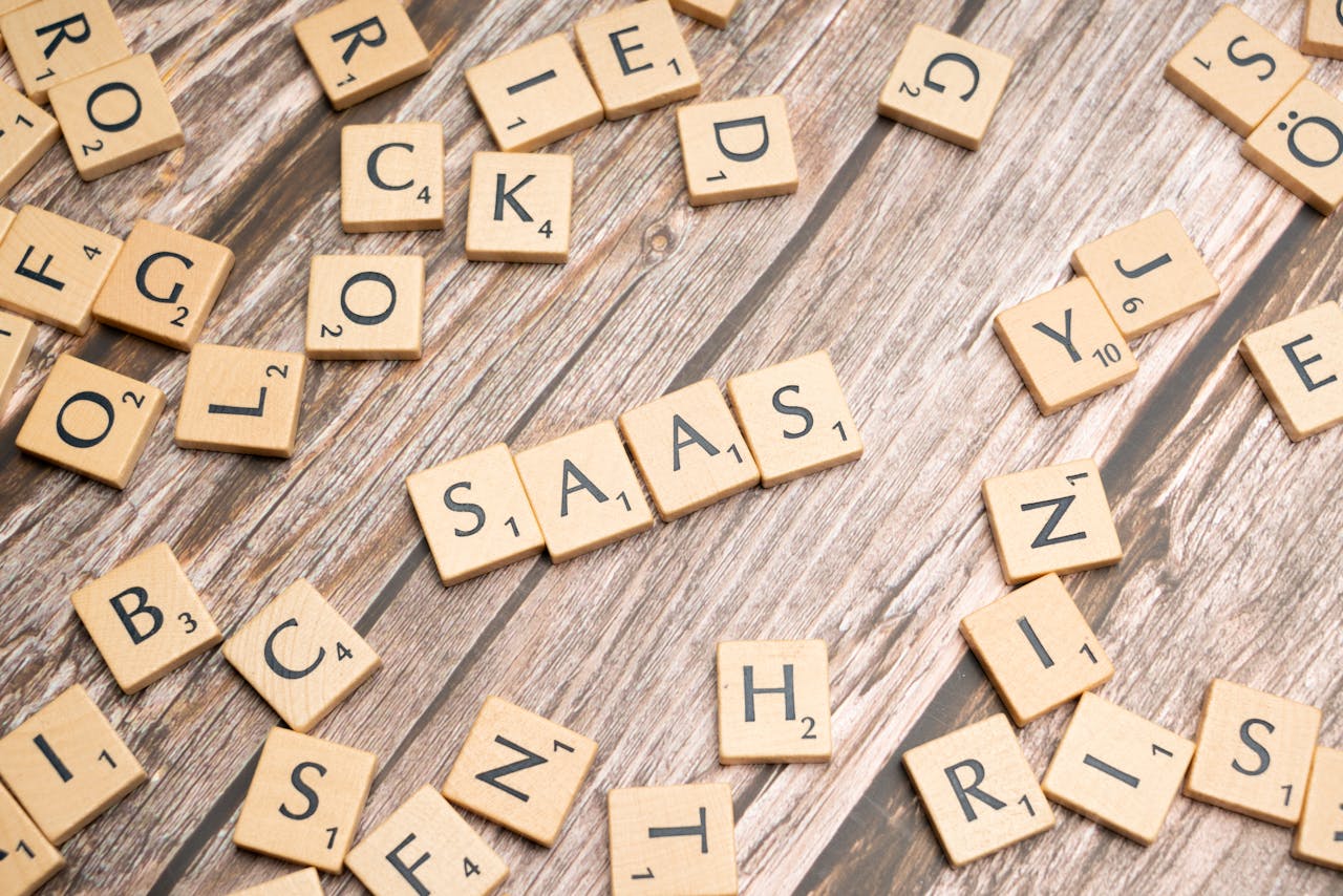 services-02 Wooden letter tiles spelling SaaS on rustic wood. Ideal for cloud computing and business concepts.